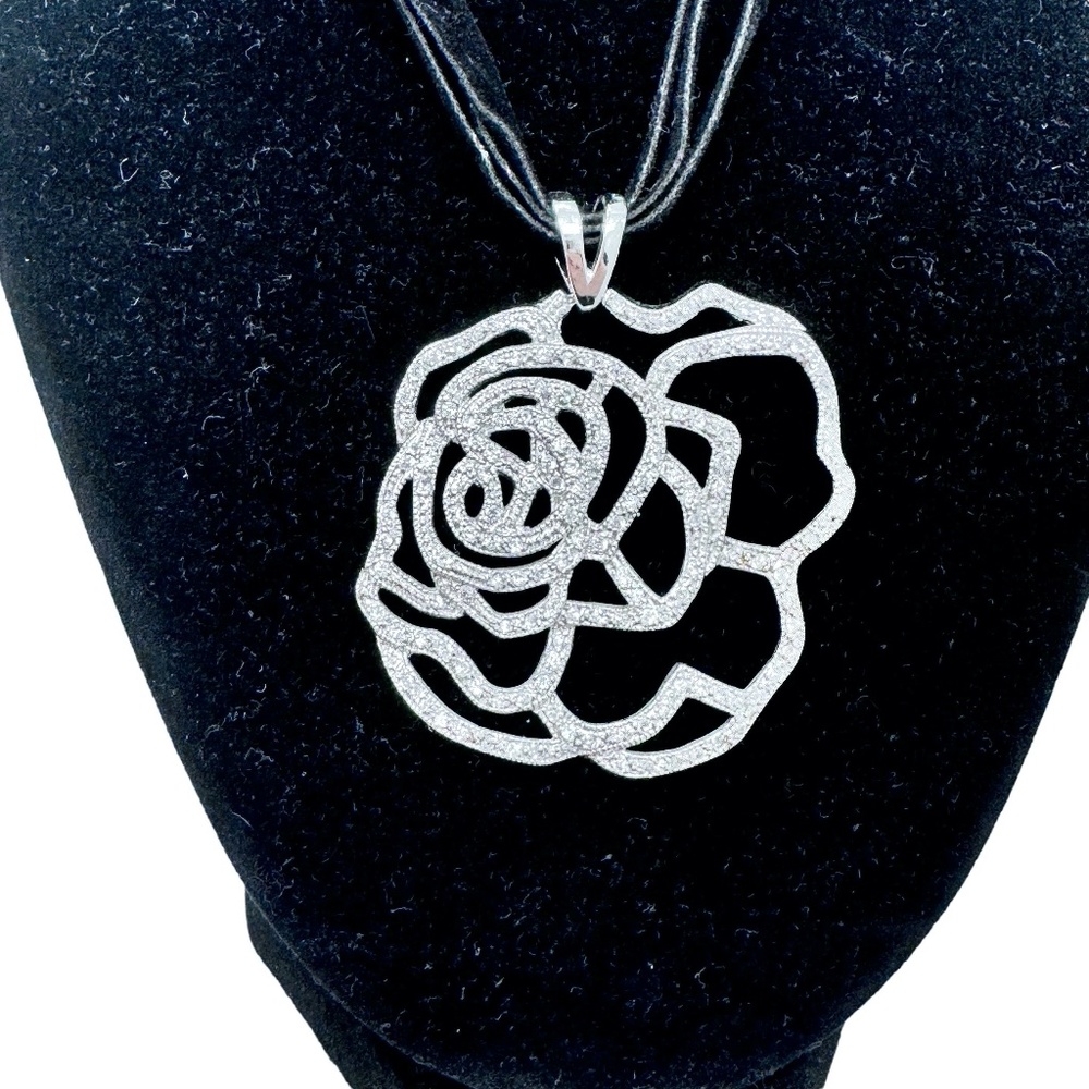 STERLING SILVER OPEN FLOWER PENDANT W MICRO PAVE STONES ON BLACK SUEDE NECKLACE